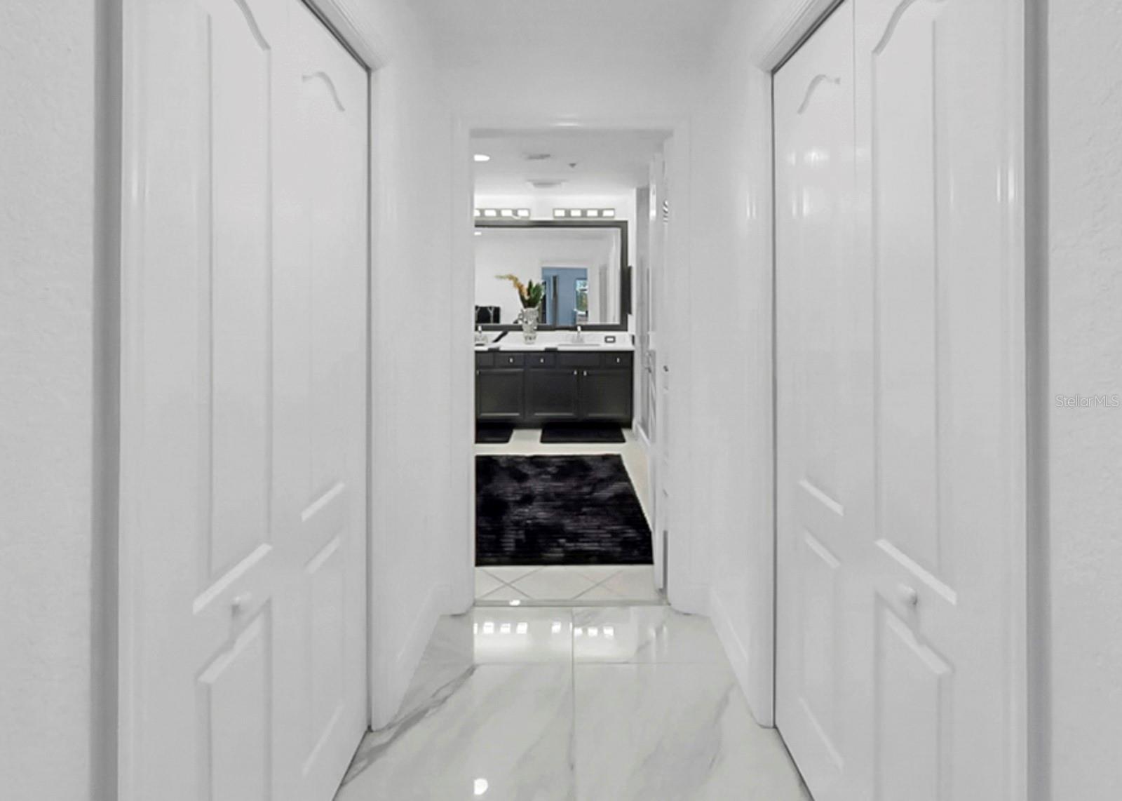 Walk in closets and entrance to Primary Bathroom