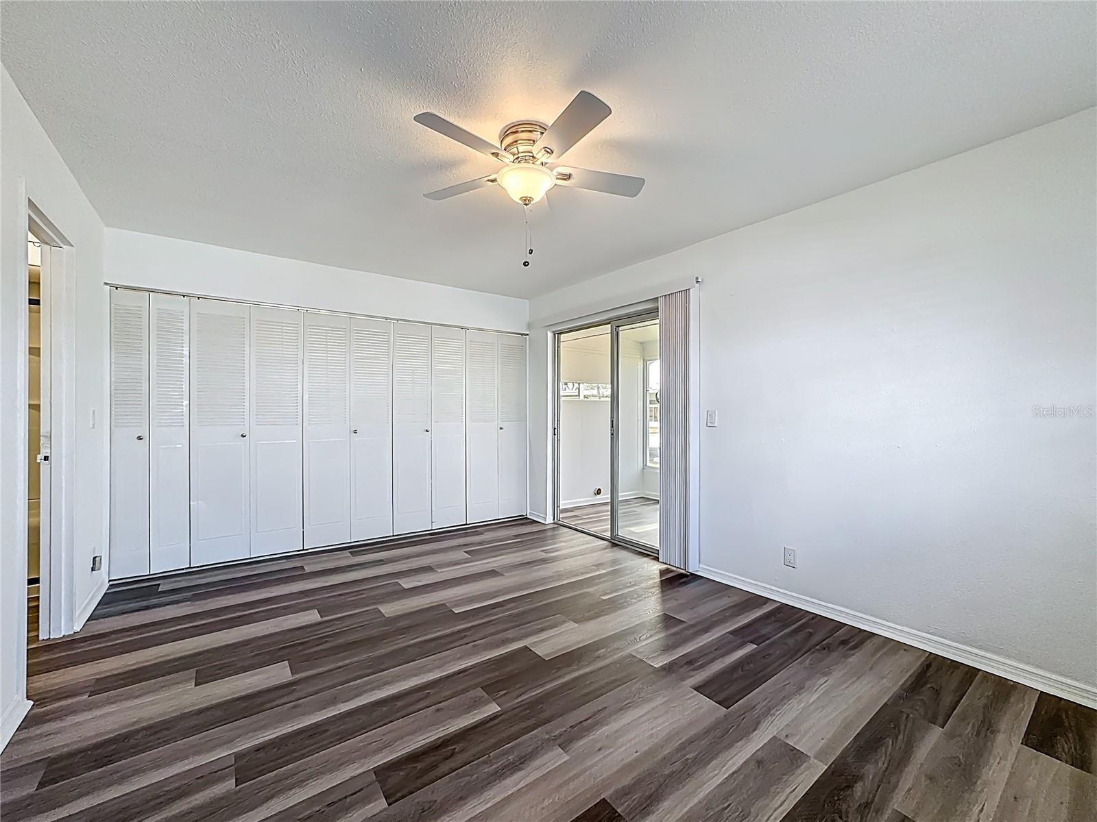 BEDROOM.  SLIDERS TO FLORIDA ROOM