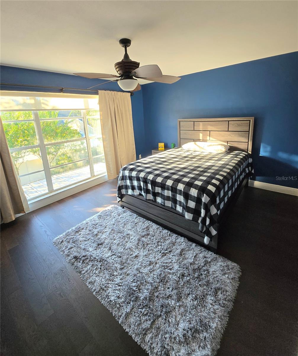 Good sized master bedroom with large window.