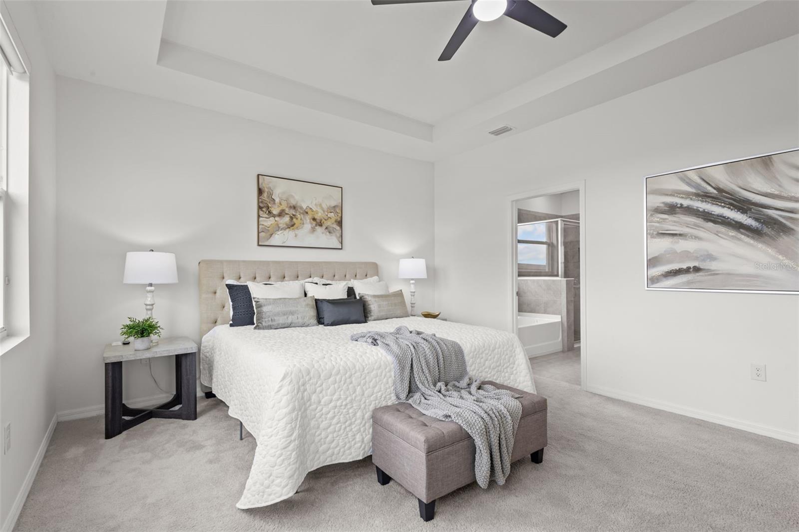 Private primary suite with serene pond views and a spacious layout that feels like its own retreat.