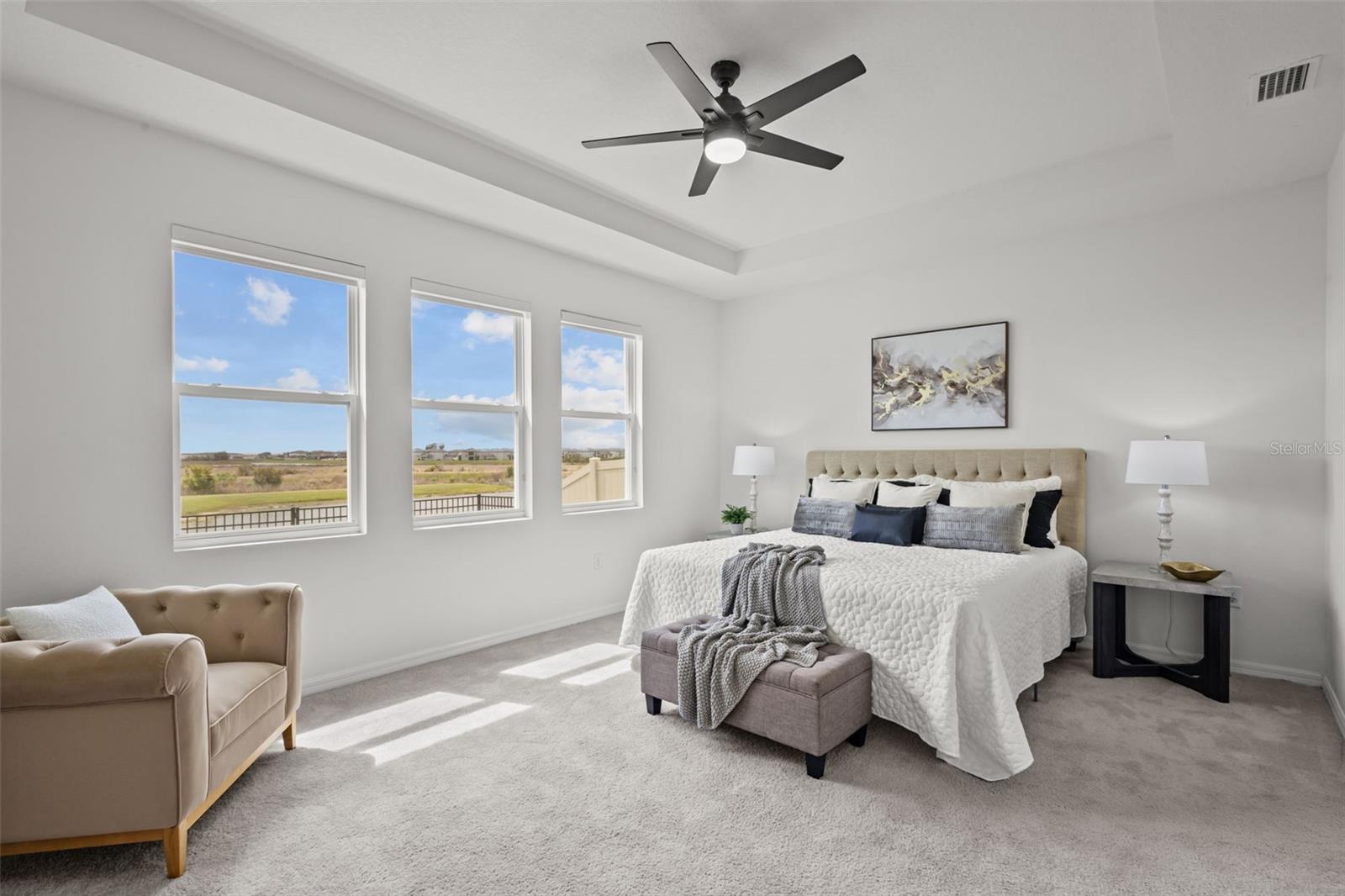 Private primary suite with serene pond views and a spacious layout that feels like its own retreat.