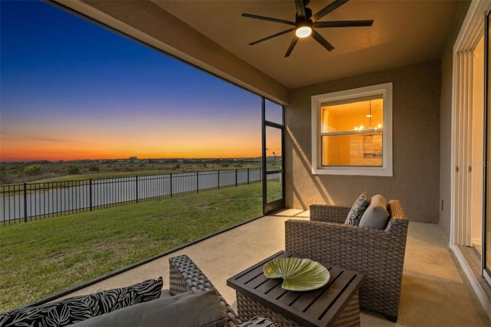 Expansive screened lanai offering the perfect place to relax while enjoying peaceful pond views.