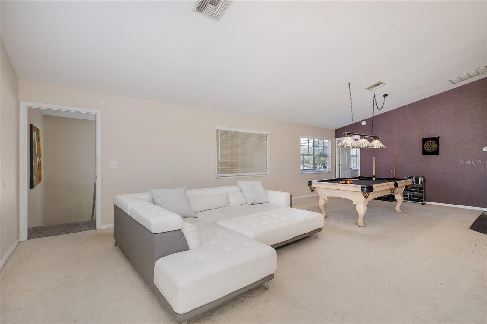 Second level, Family room / loft with full-kitchen and balcony.