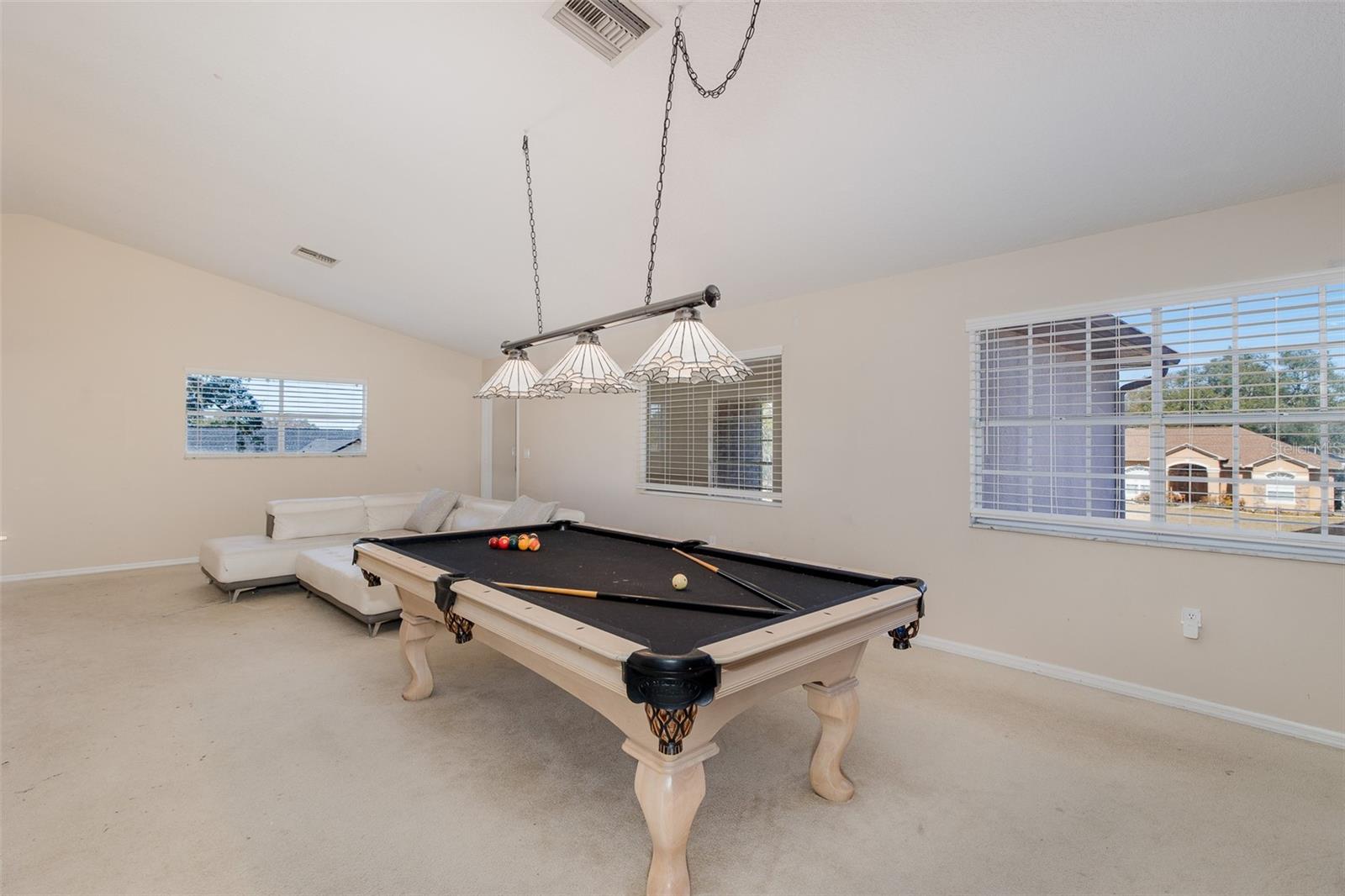 Second level, Family room / loft with full-kitchen and balcony.