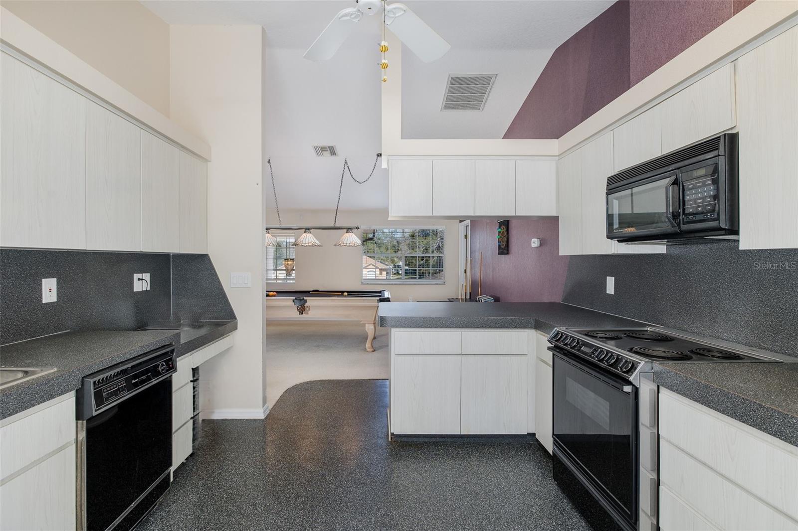 Second level, full-kitchen with balcony.