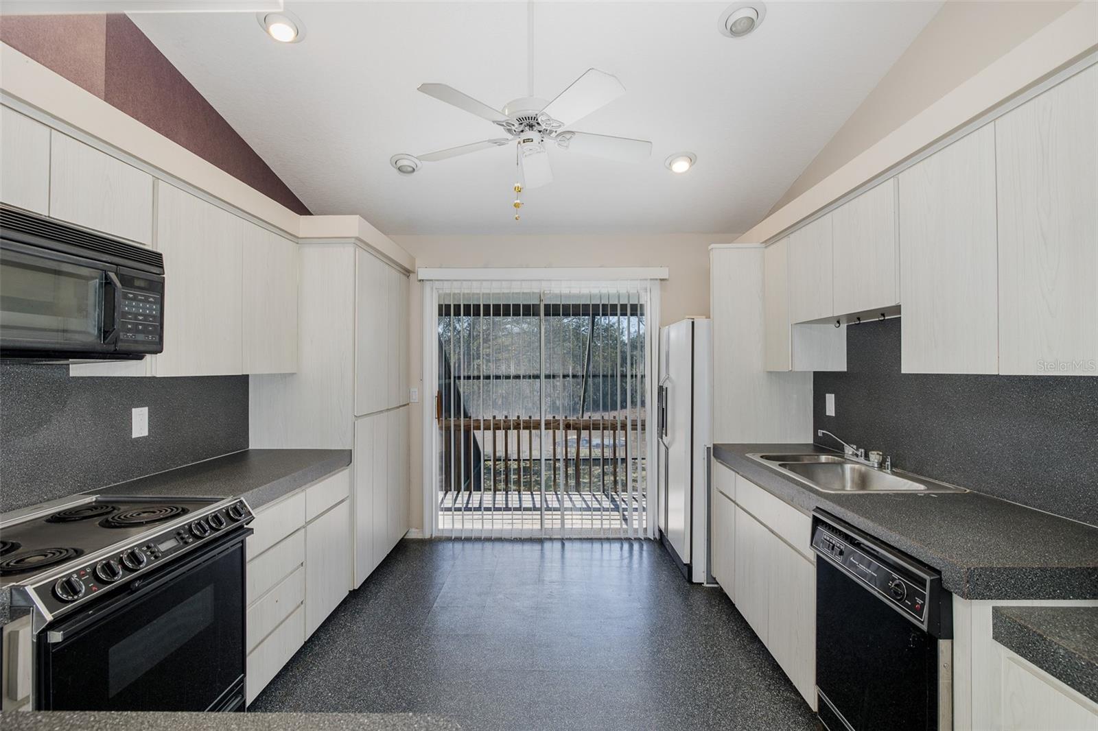 Second level, full-kitchen with balcony.