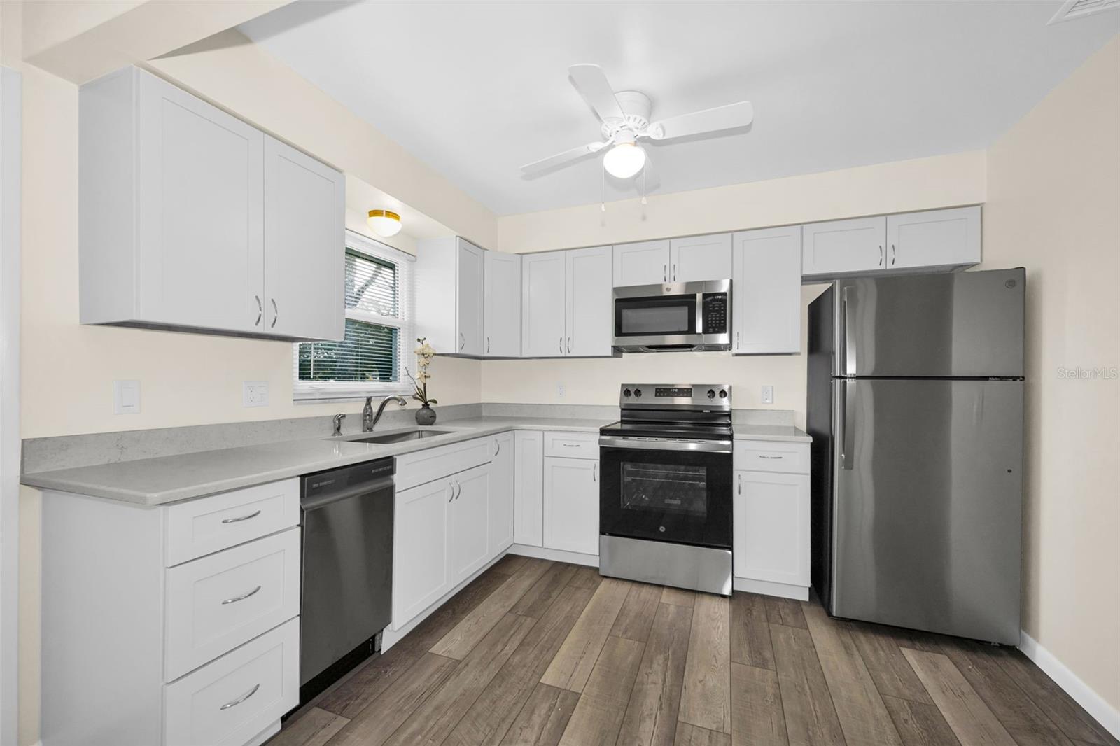 New GE appliances, cabinets, quartz countertops and lighting and WINDOWS THROUGHOUT THE HOME!