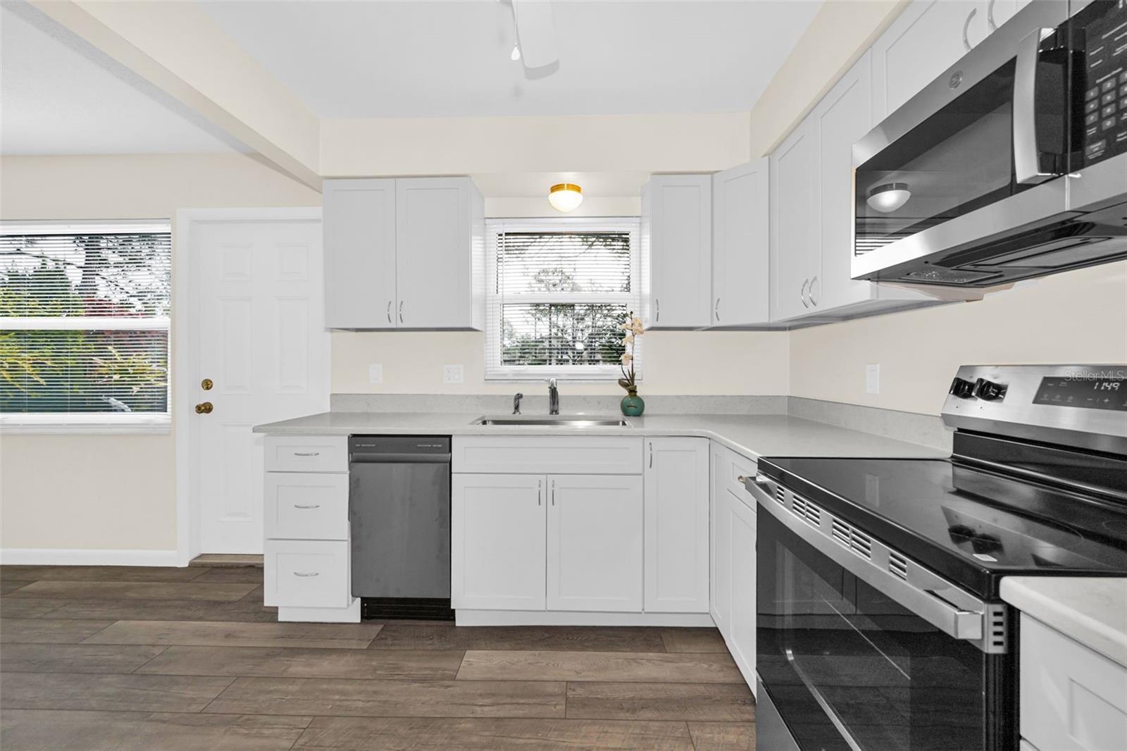 Gorgeous new Kitchen with new stainless steel appliances, new windows throughout the home, and new flooring!  Clean, modern and fresh. The perfect lock and go home for the busy person over a certain age!