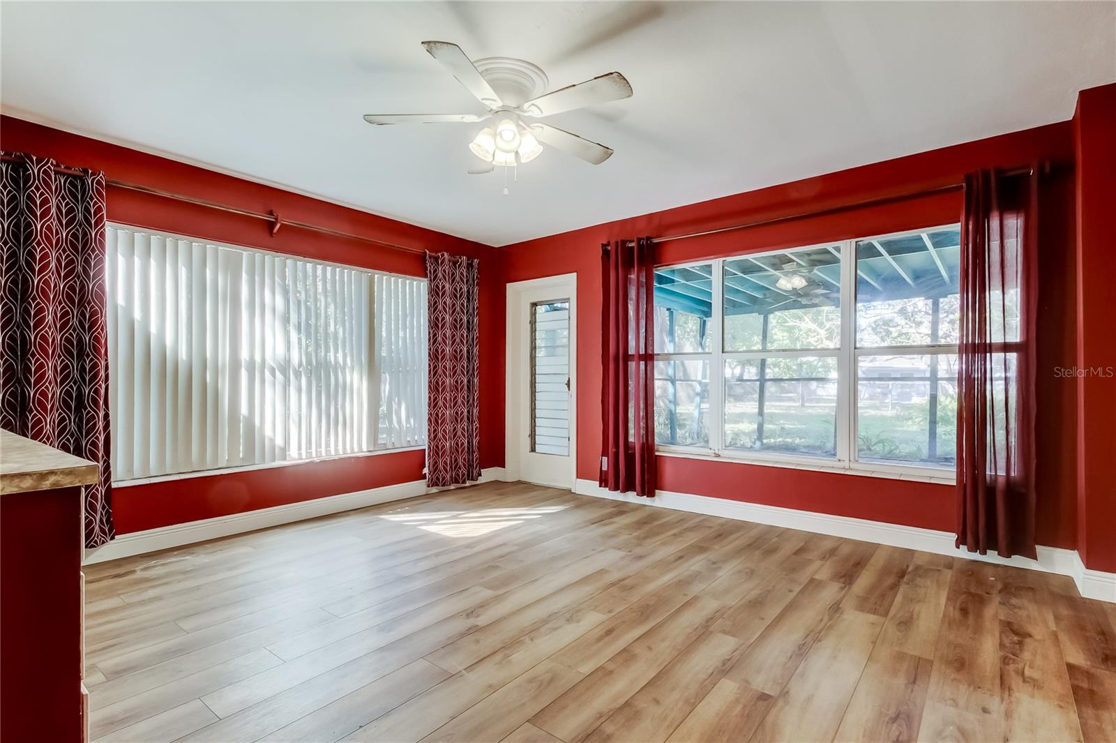 Family Room has lots of natural light  - Approximately 15' x 14' - Door leads to covered screened in porch
