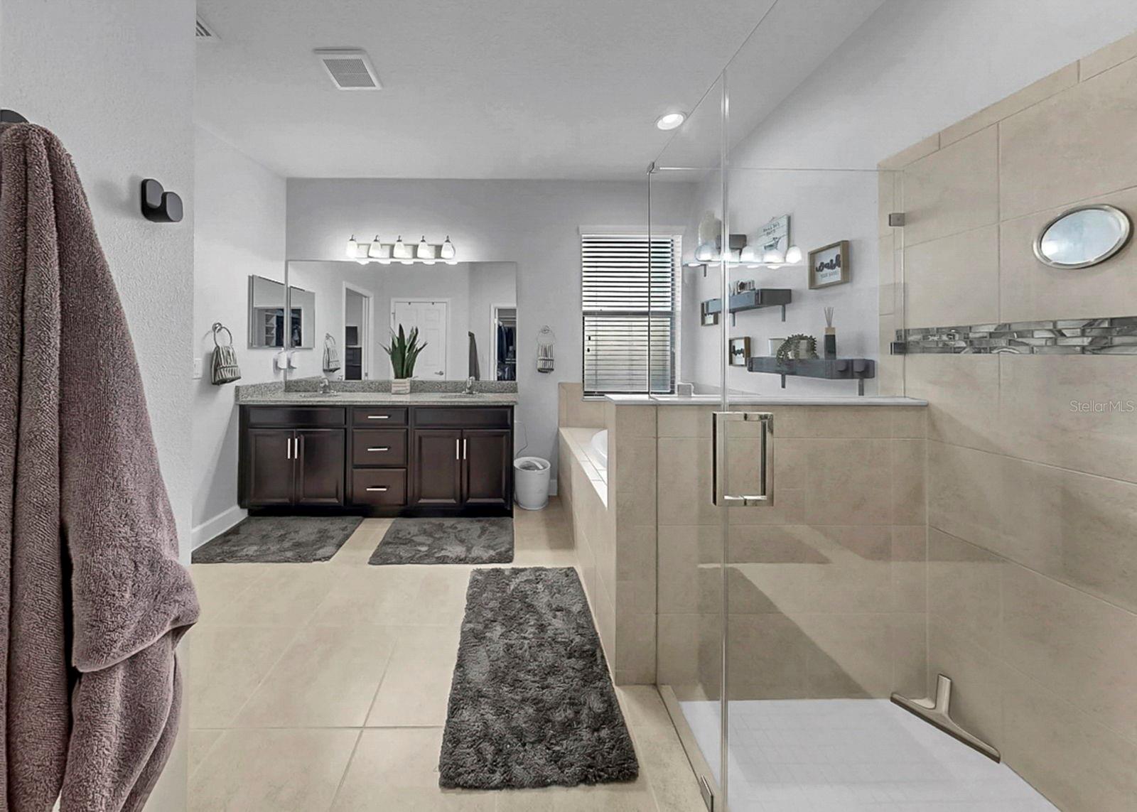 Primary bathroom with frameless shower