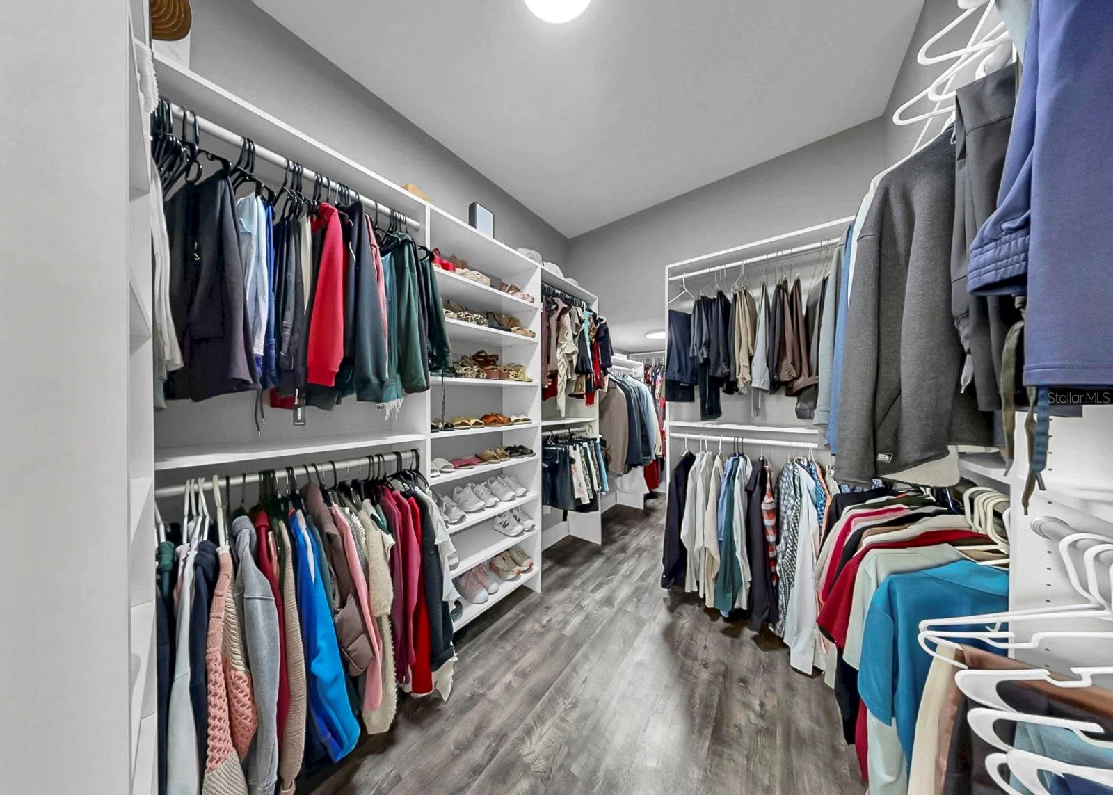 Primary bedroom closet with California Closet system