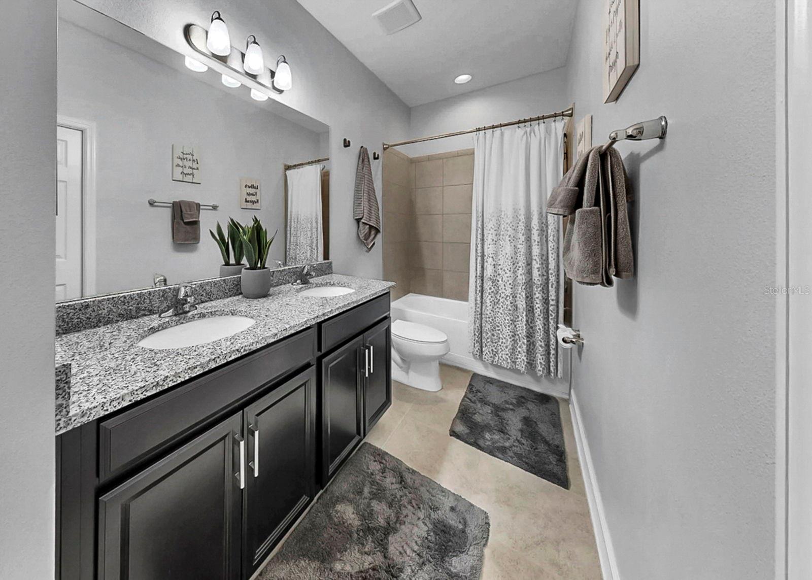 Jack-and-jill bathroom with dual sinks