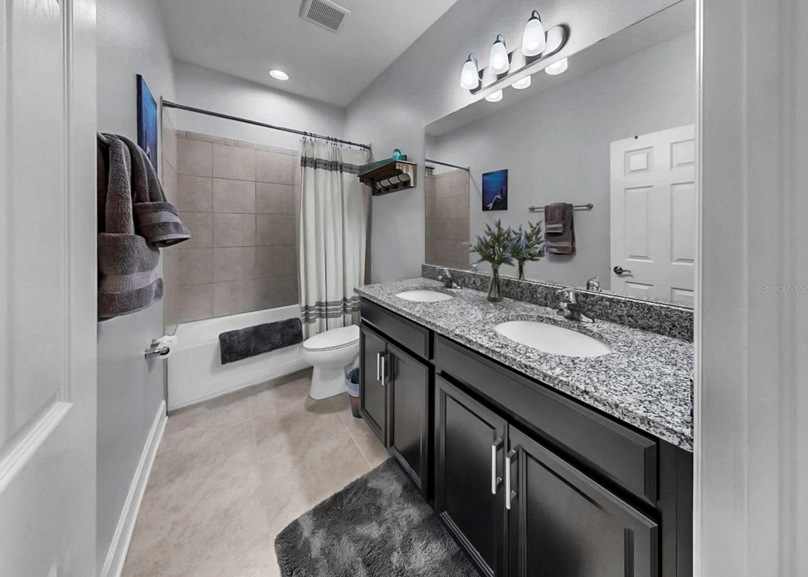 Upstairs bathroom with dual sinks