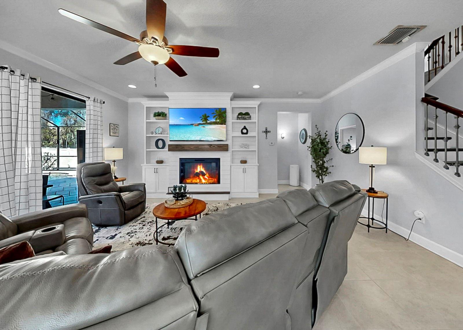 Living room with hallway leading to primary bedroom
