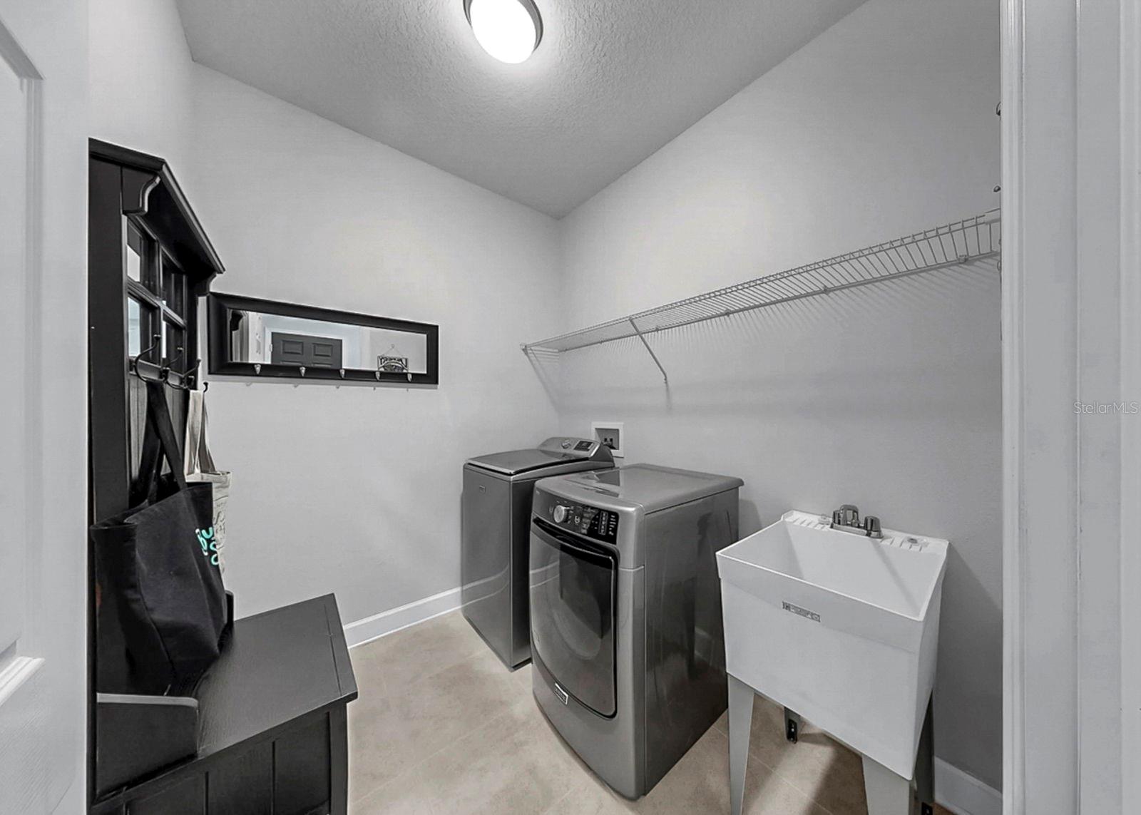 Laundry room equipped with a utility sink