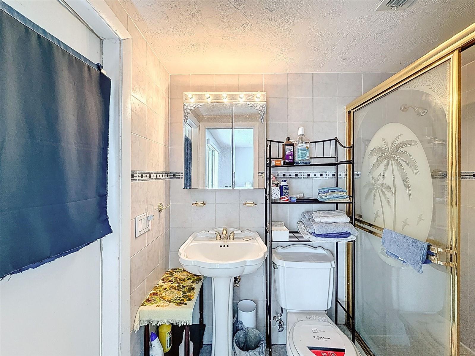 PRIMARY BATH with BACK DOOR to POOL