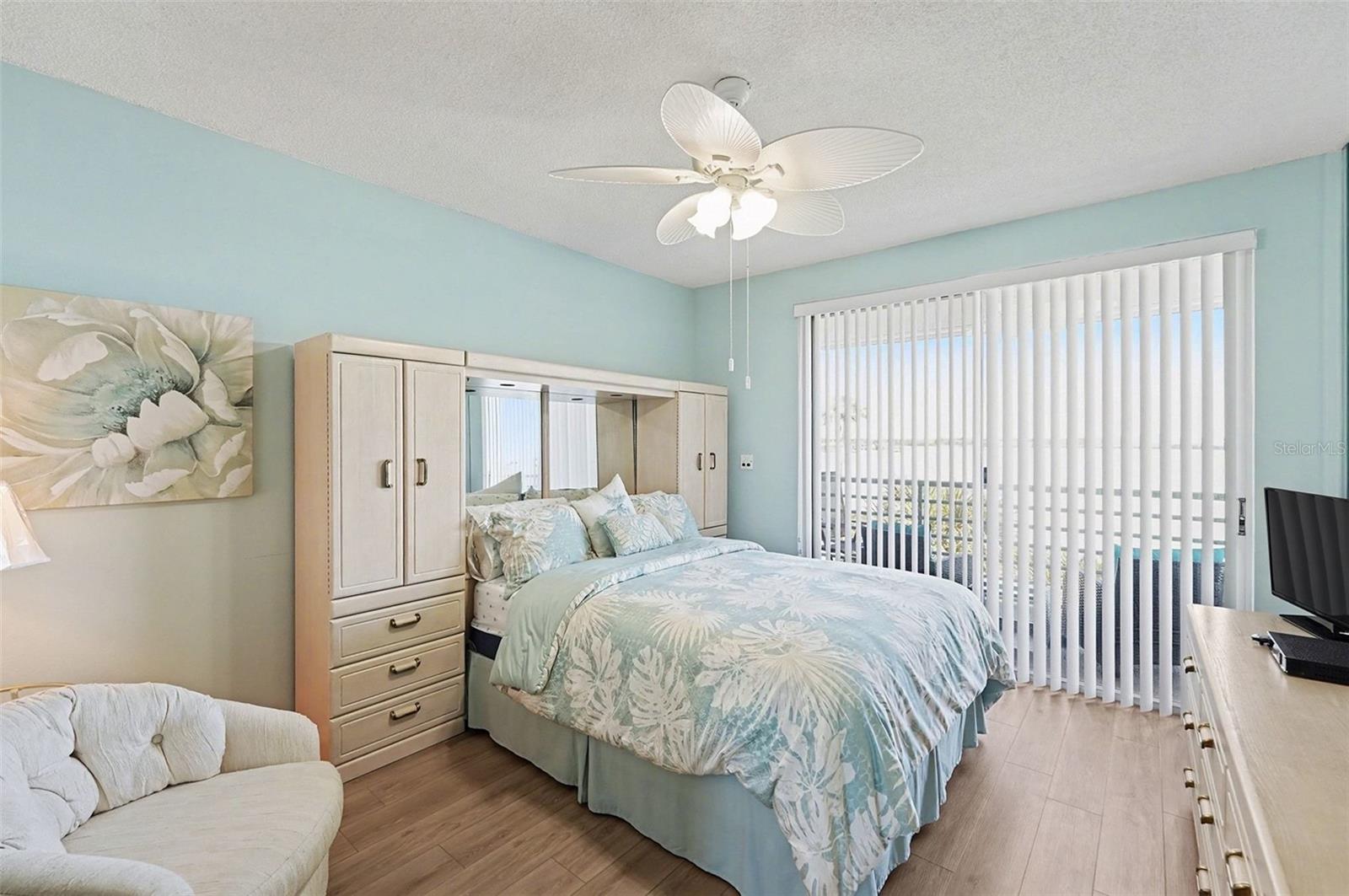 Sliders open to your private balcony overlooking the ocean in the primary bedroom as well as the living room