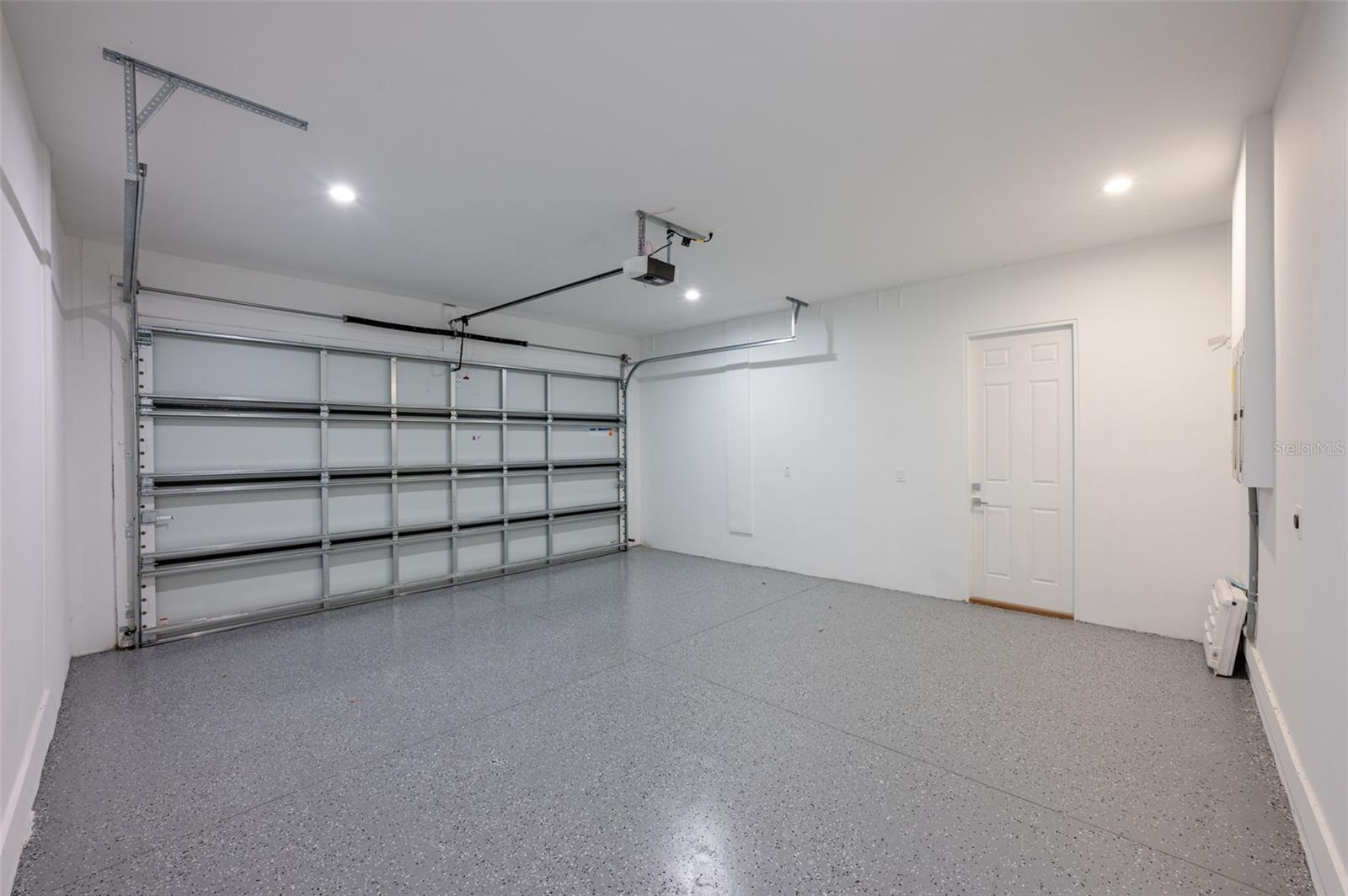 two car garage that includes outlet for electric cars