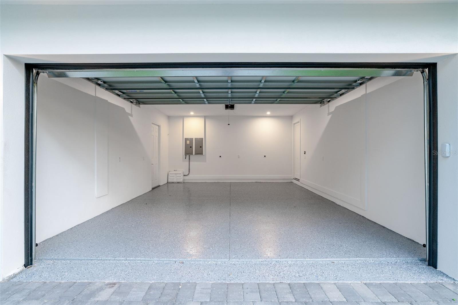 two car garage that includes outlet for electric cars