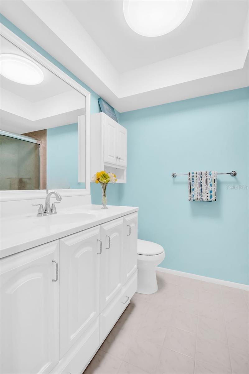 Updated hall bath with an oversized vanity, lighting, & linen closet~