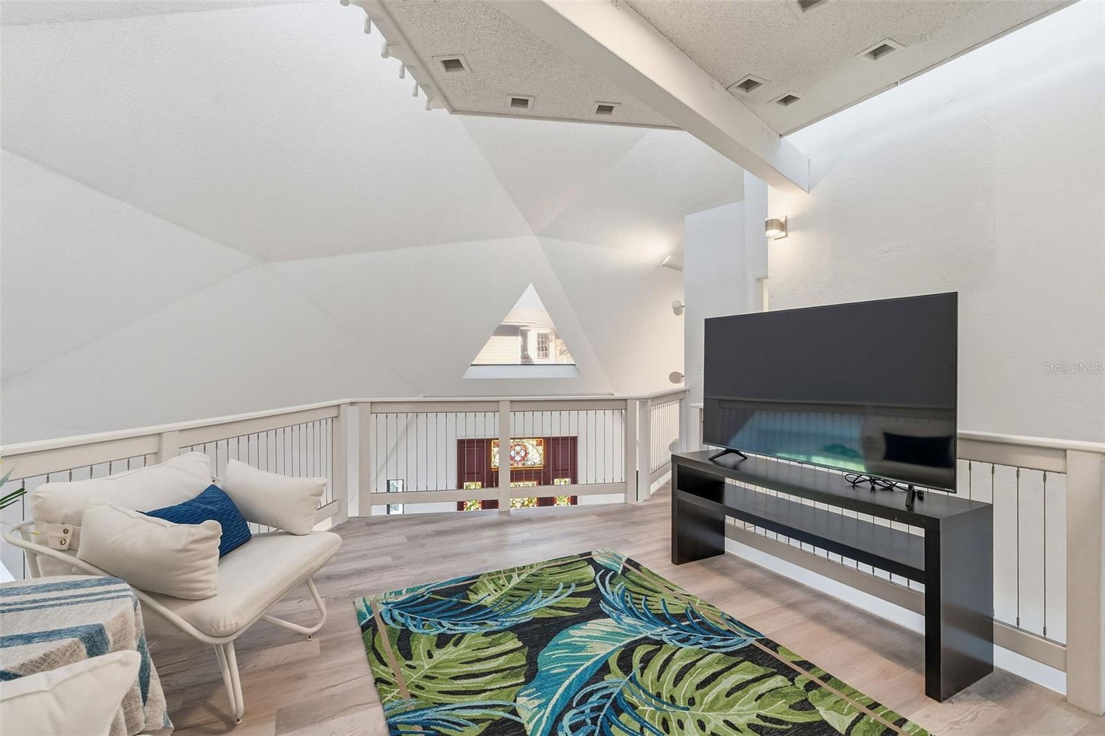 Primary entertainment area off primary bedroom