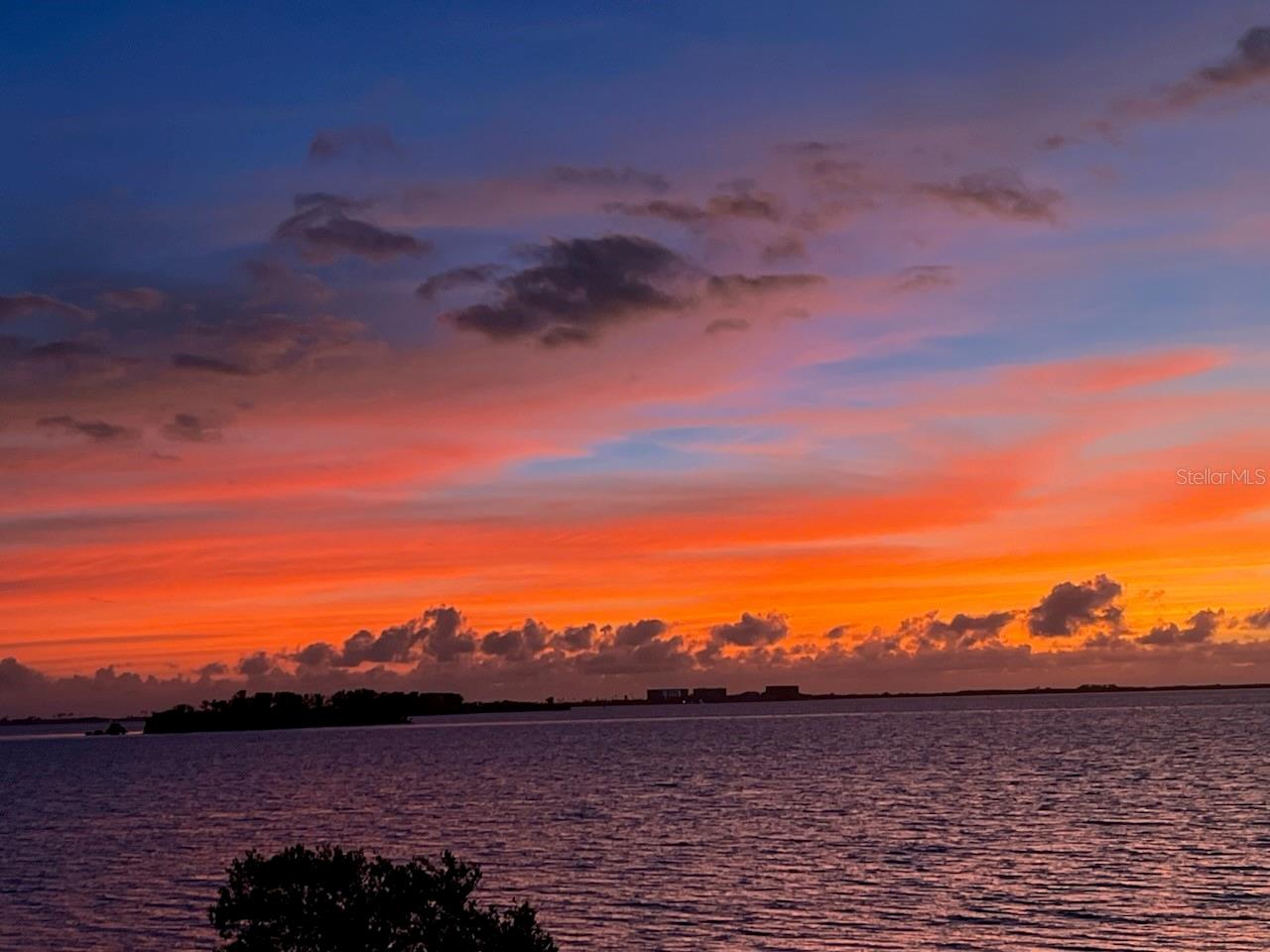 One of many picturesque sunsets from First floor deck. Honeymoon island in the distance.