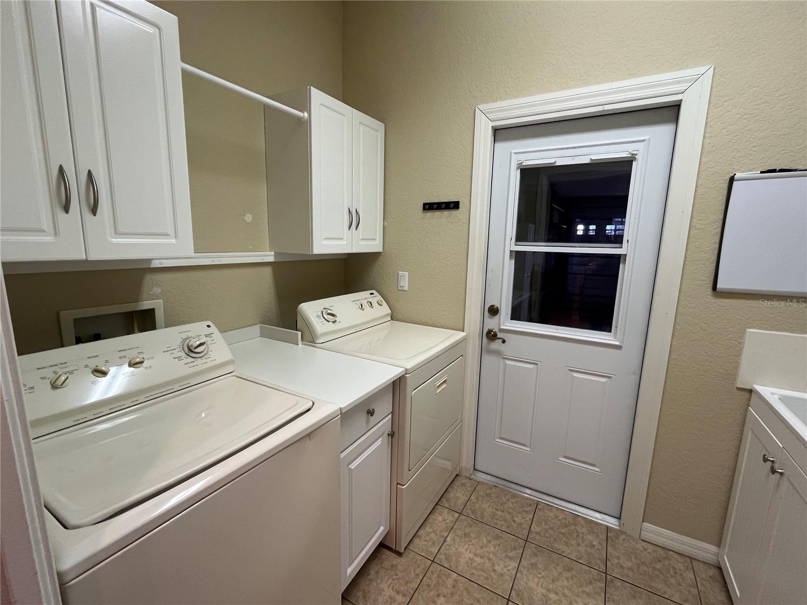 BETWEEN THE KITCHEN AND GARAGE