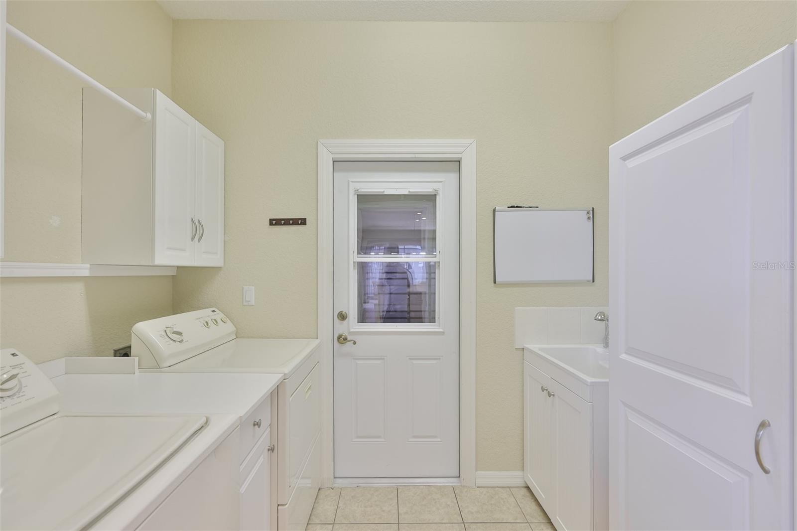 EXTRA STORAGE AND PANTRY CABINET IN LAUNDRY JUST OFF KITCHEN