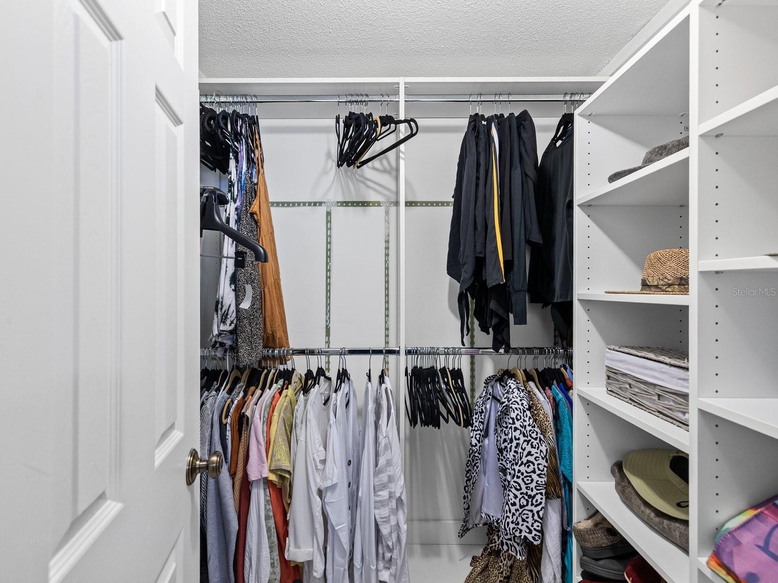 Walk in closet in primary bedroom