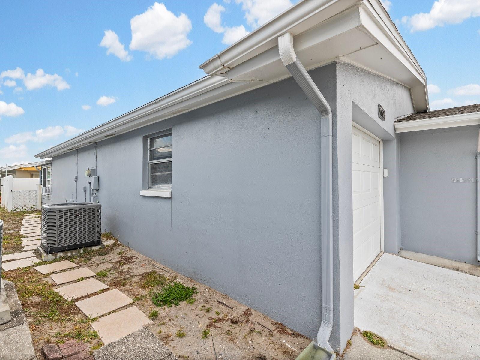 Left side of home with gutters on newer Roof (2021)