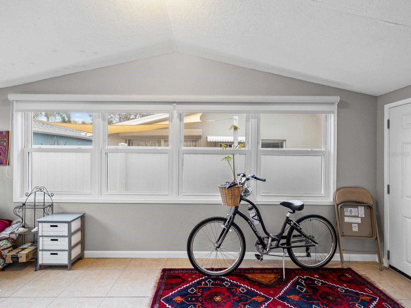 Florida room across back of home off kitchen and dining room