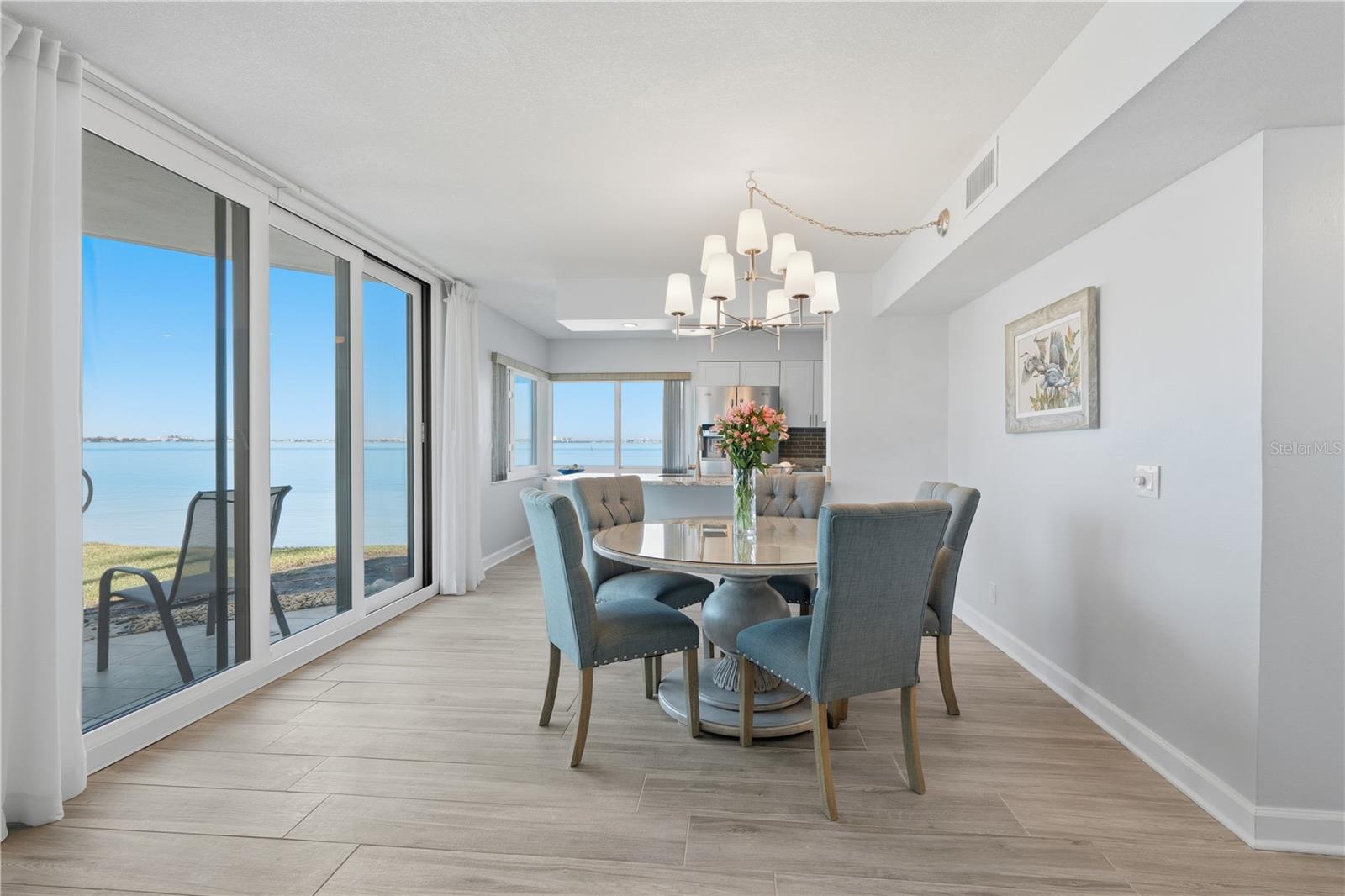 The luxurious wide plank LVP flooring creates a seamless flow throughout the condo.