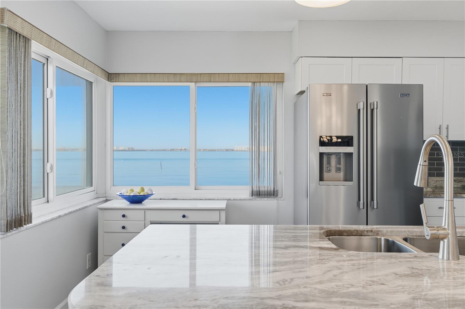 The comprehensive remodel features sleek Quartz counters and the securtity of Hurricane Impact Rated sliding doors and windows.