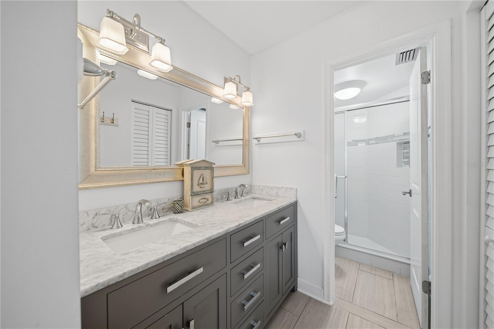 The primary ensuite bath has a double sink vaniey and a spacious shower.