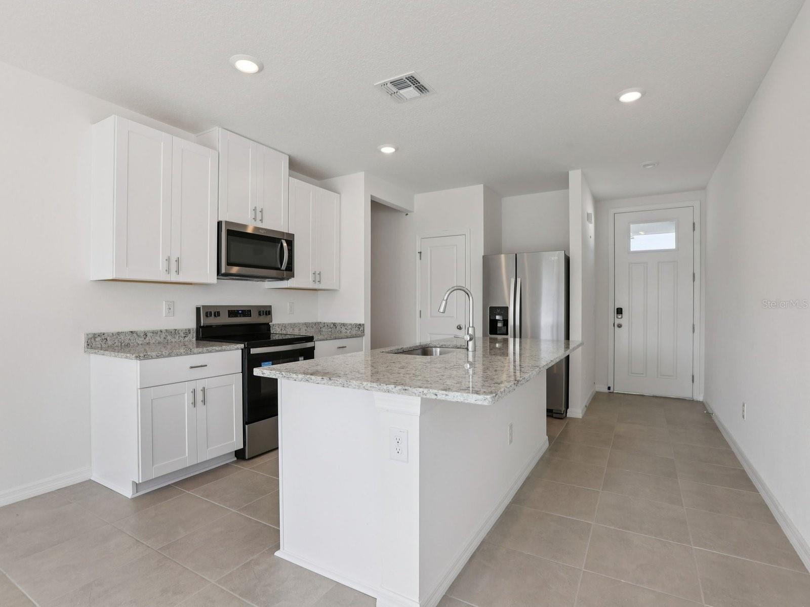 Interior photos are not of the actual home but are photos of the builder home with the same floorplan with similar interior finishes and features.