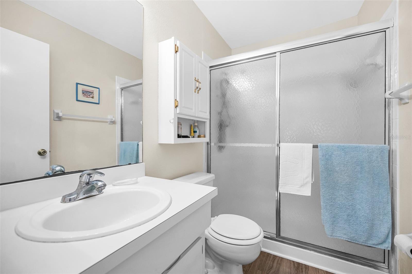 in suite primary with walk in shower