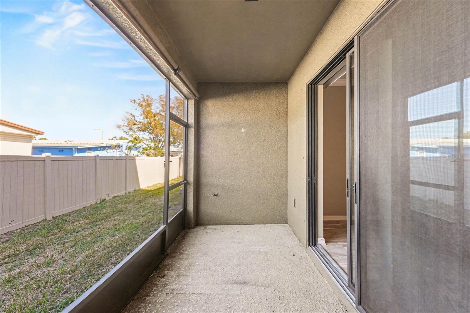 Sliding Glass Doors: Large sliders in the living room allow for plenty of natural light and lead to the screened porch.