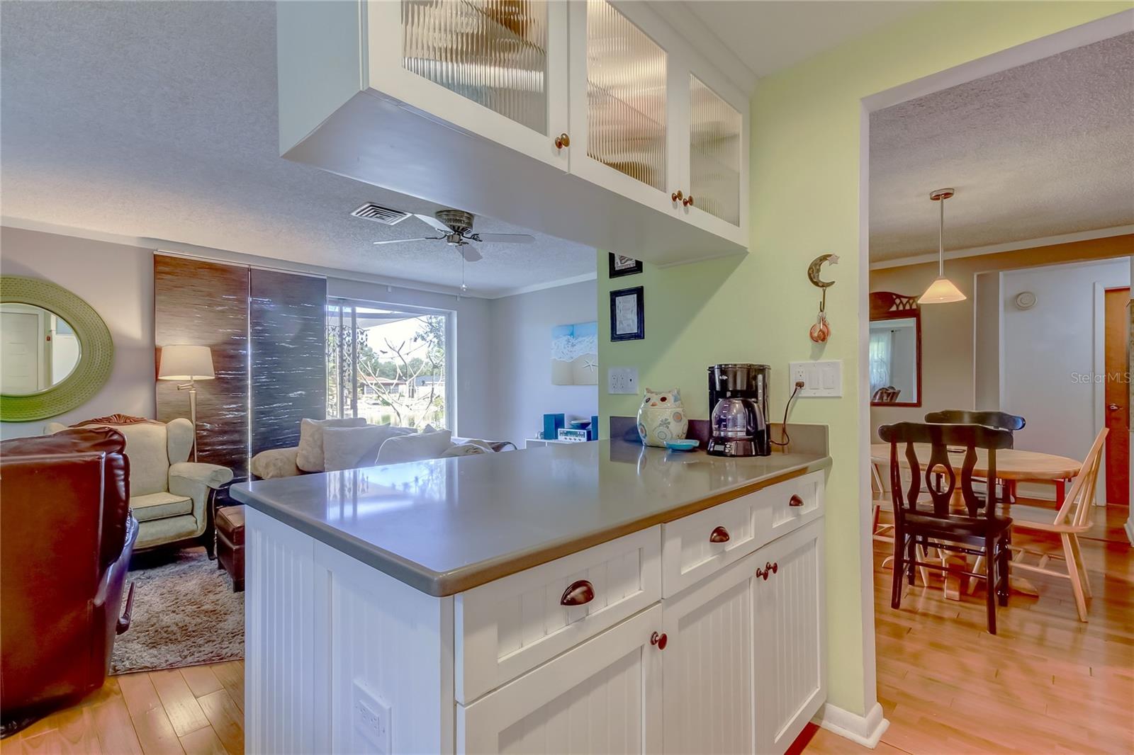 Kitchen peninsula central to dining and family rooms