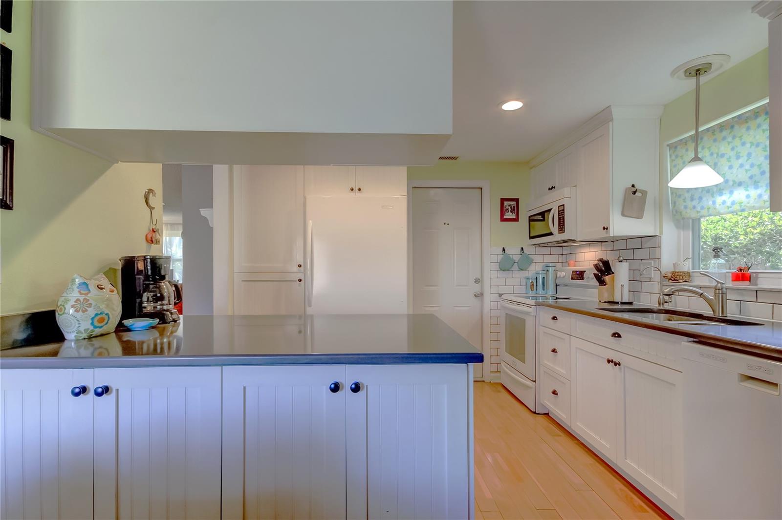Kitchen storage in peninsula from family room