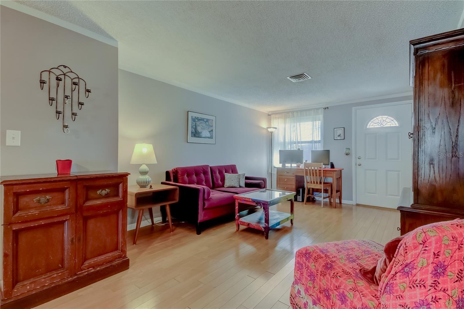 from dining room into front living room/front entrance.