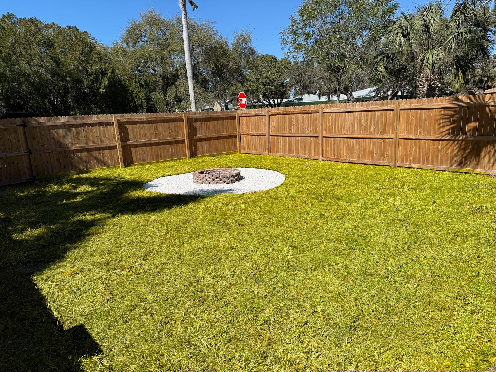 fully fenced Side Yard and Firepit