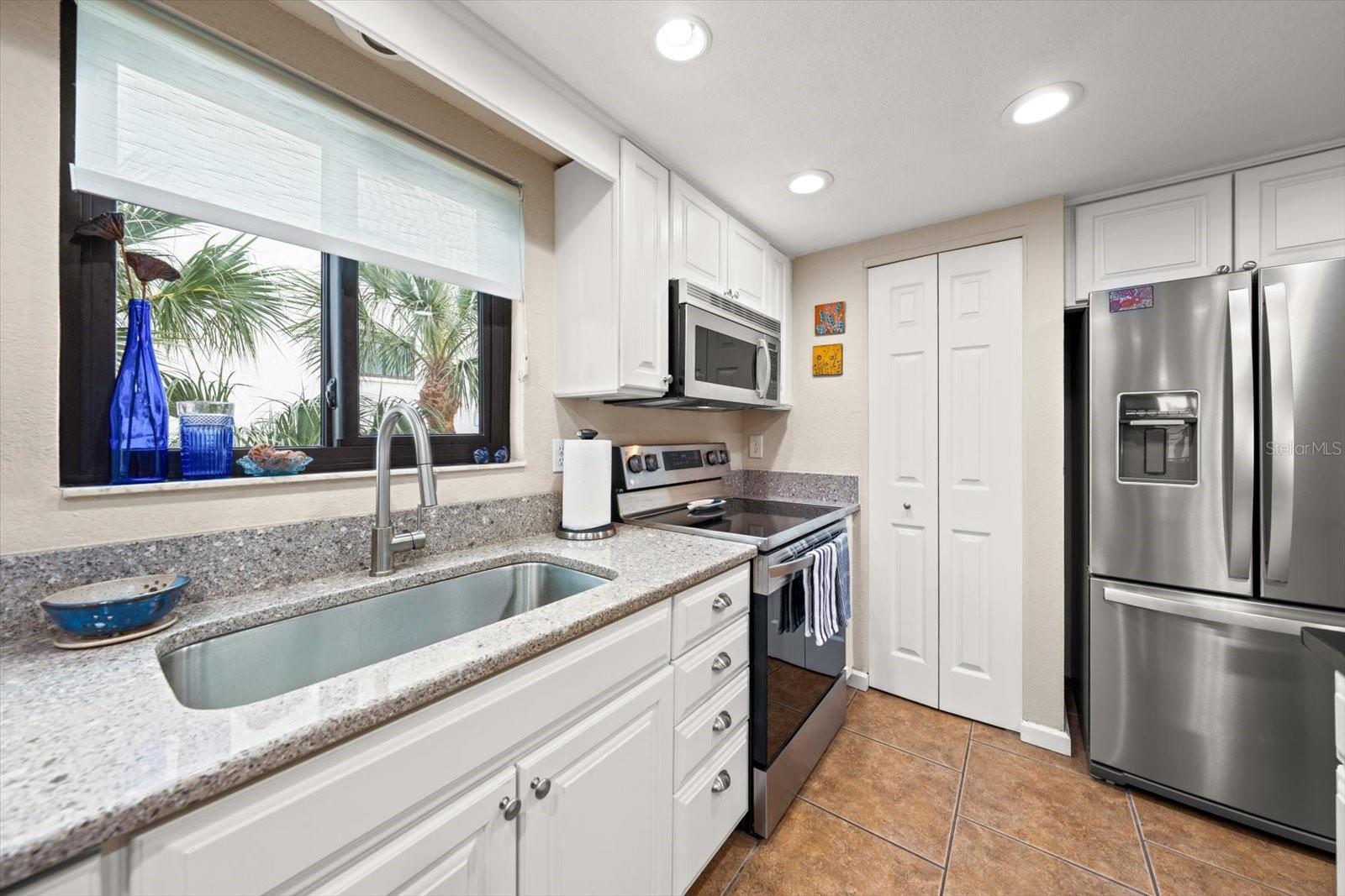 Ample counter space, and a walk in pantry lends to additional work space and storage.