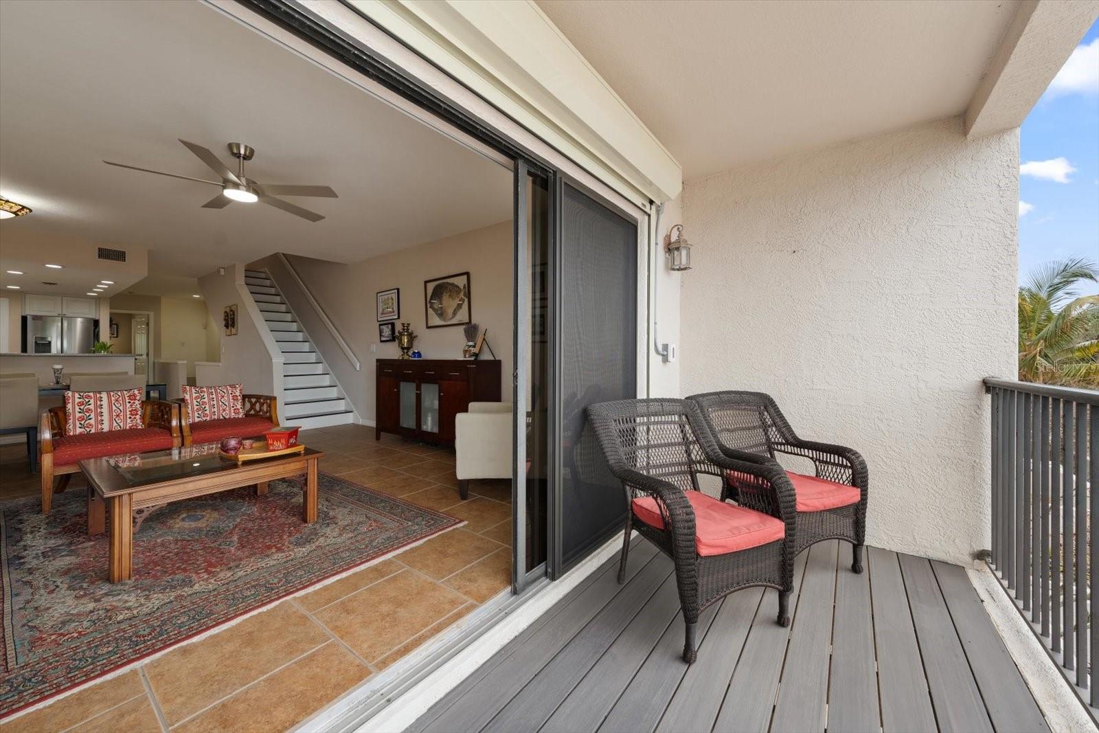 Living area opens seamlessly to the outdoors. Electronic storm shutters on main living level and ground level.