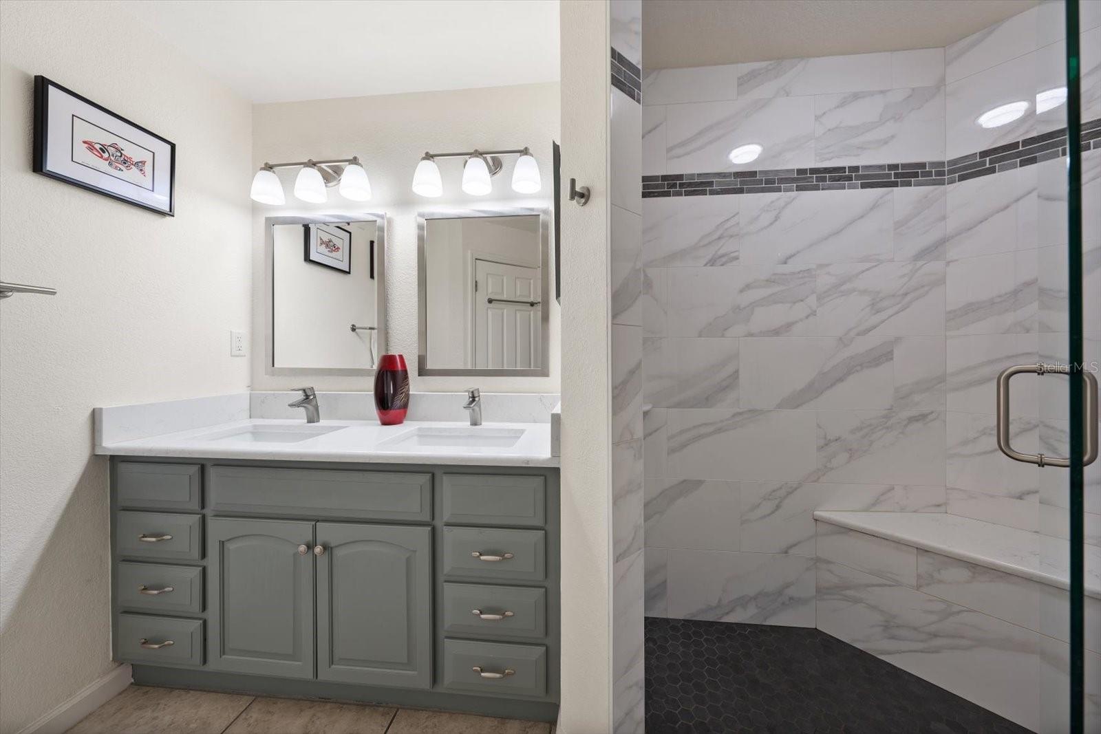 Primary bath area with spacious walk in shower.