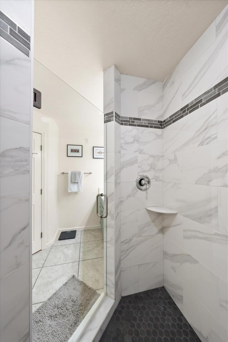 Walk in shower in primary bath area.