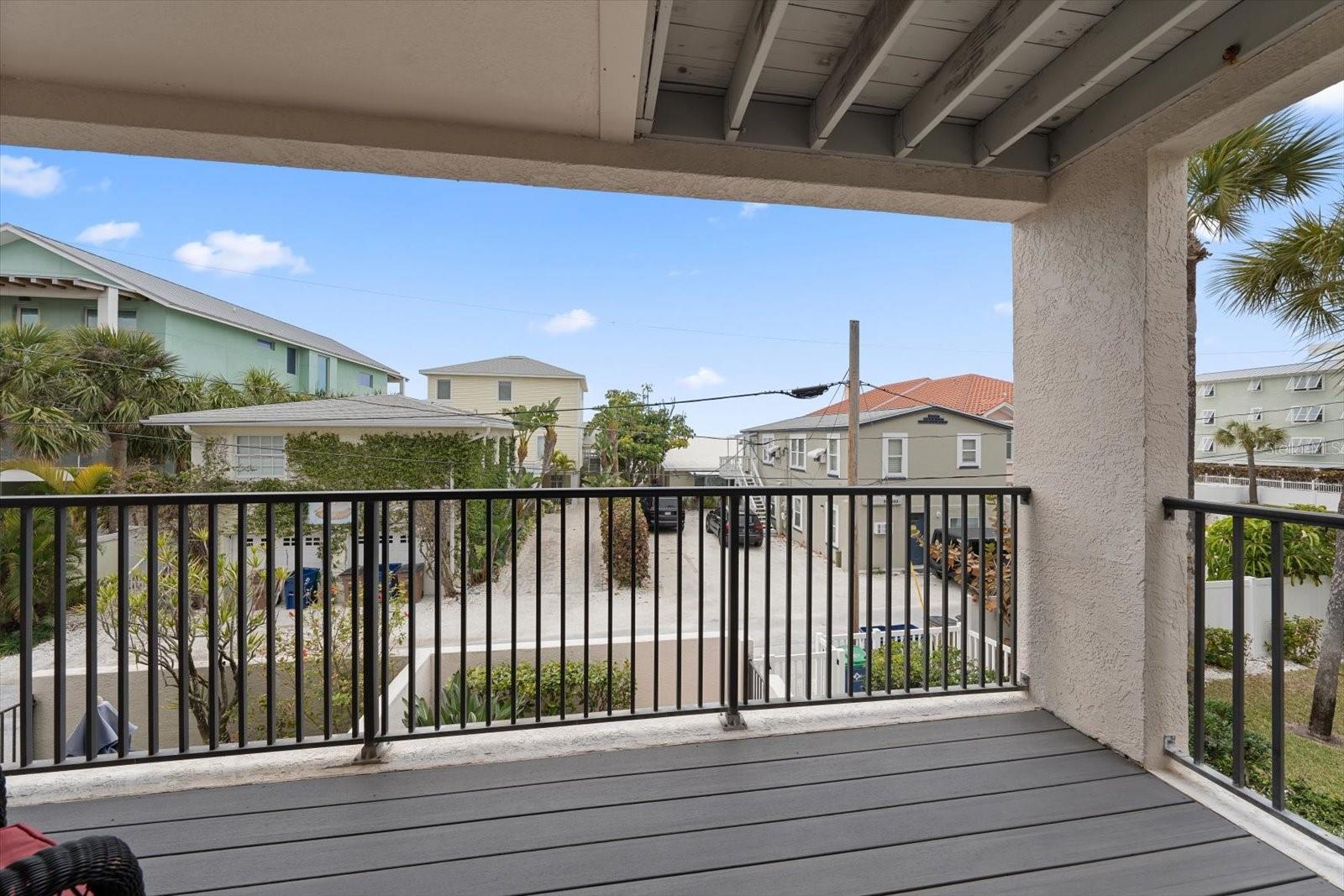 Private porch with attractive Trex flooring.. The perfect spot for sunsets and cool Gulf breezes!