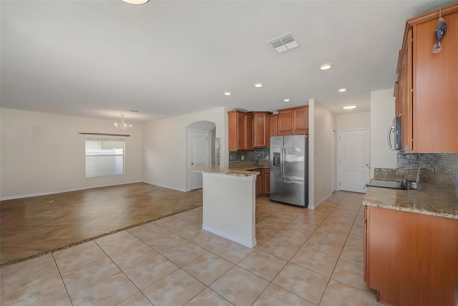 STAGED KITCHEN TO DINING TO LIVING