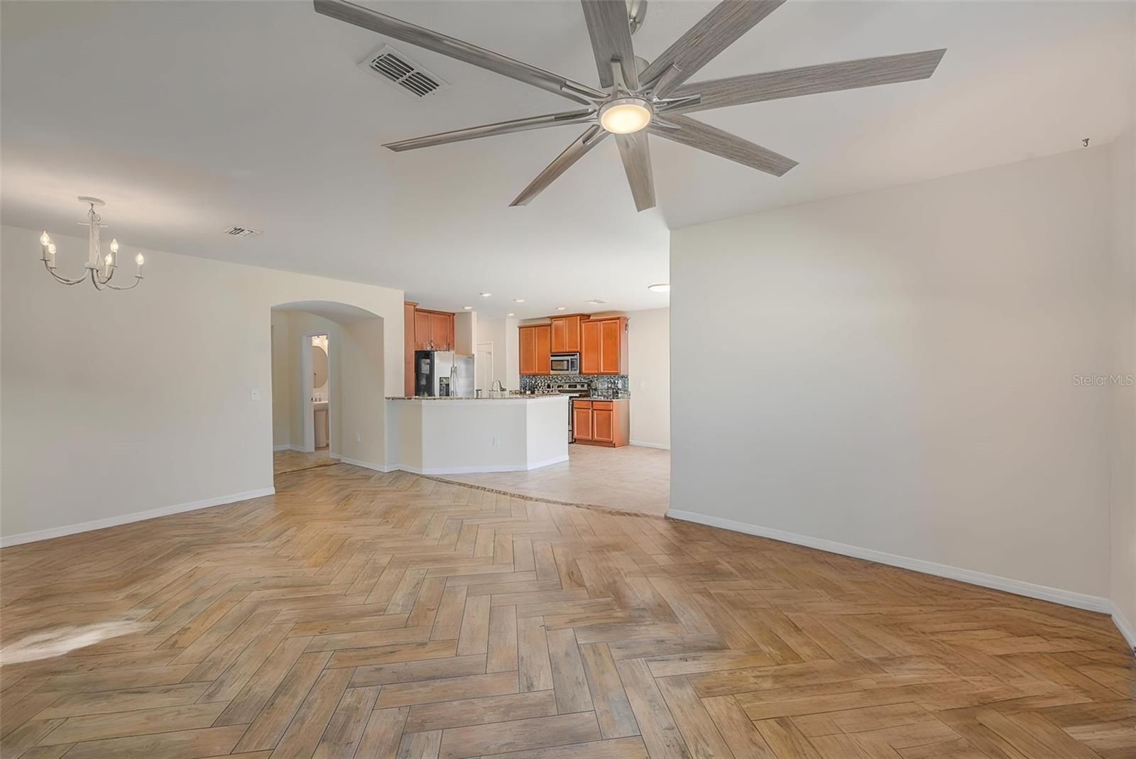 STAGED LIVING TO DINING TO KITCHEN