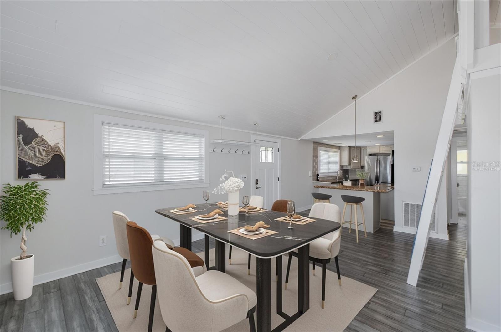 Virtually staged dining area and kitchen