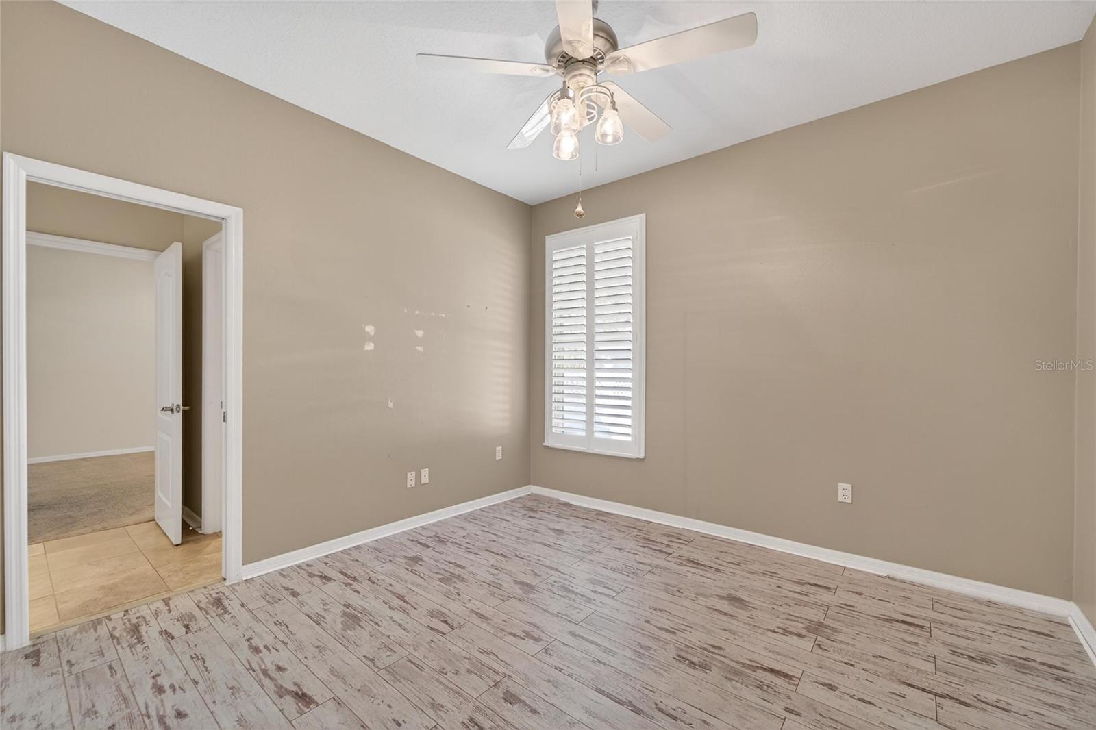 Bedroom #3 with (distressed boardwalk-look) laminate flooring